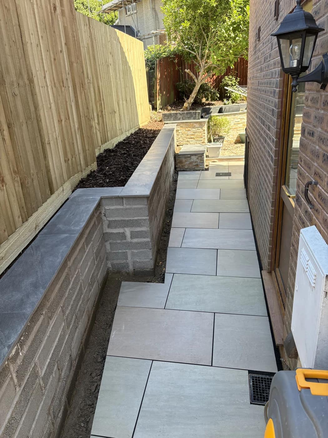 Rendered raised planter slate coping side path bridgend by HJB