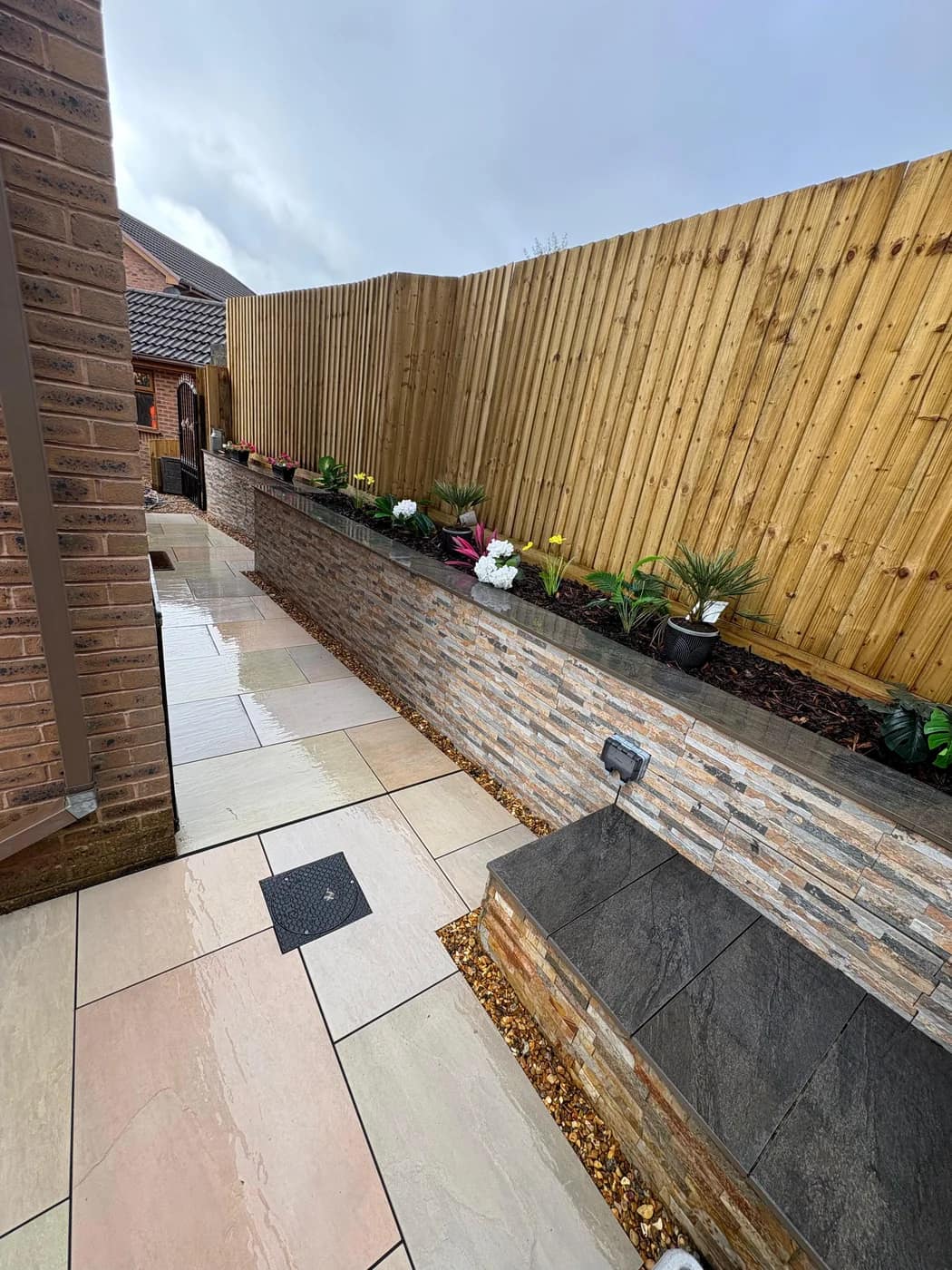 Sandstone patio stone clad raised bed bridgend by HJB