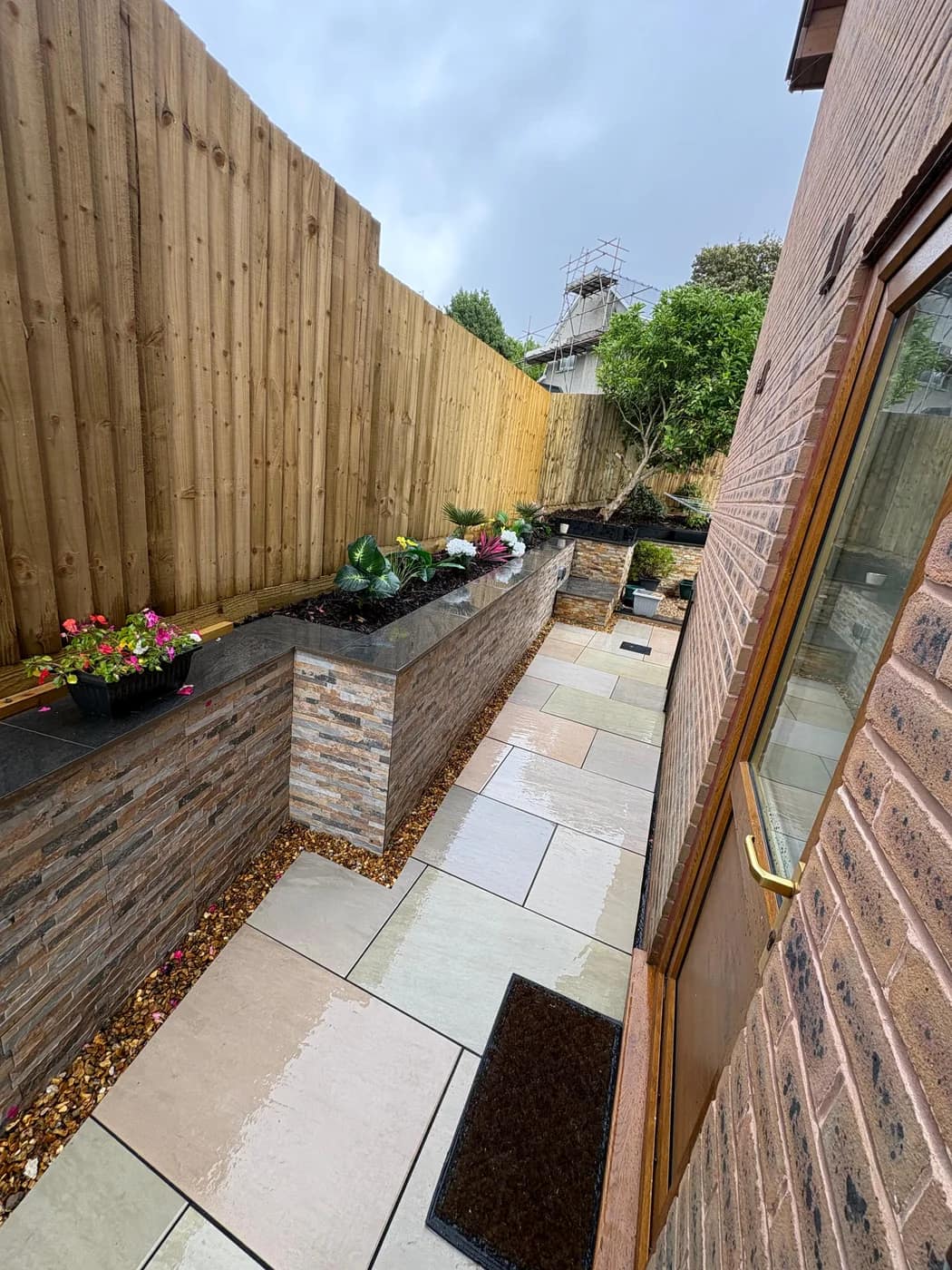 Sandstone paving side return rendered planter bridgend by HJB