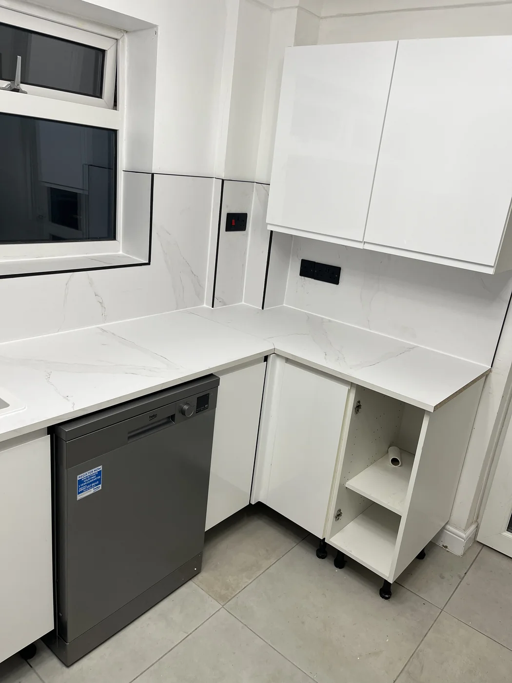 Modern kitchen with corner units in a Bridgend renovation by HJB