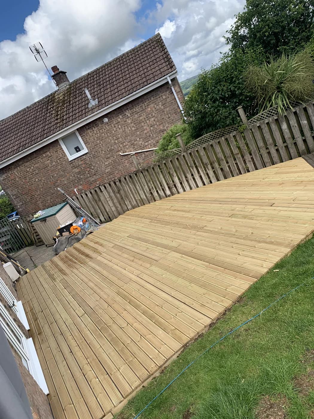 Timber decking installation rear garden sarn by HJB