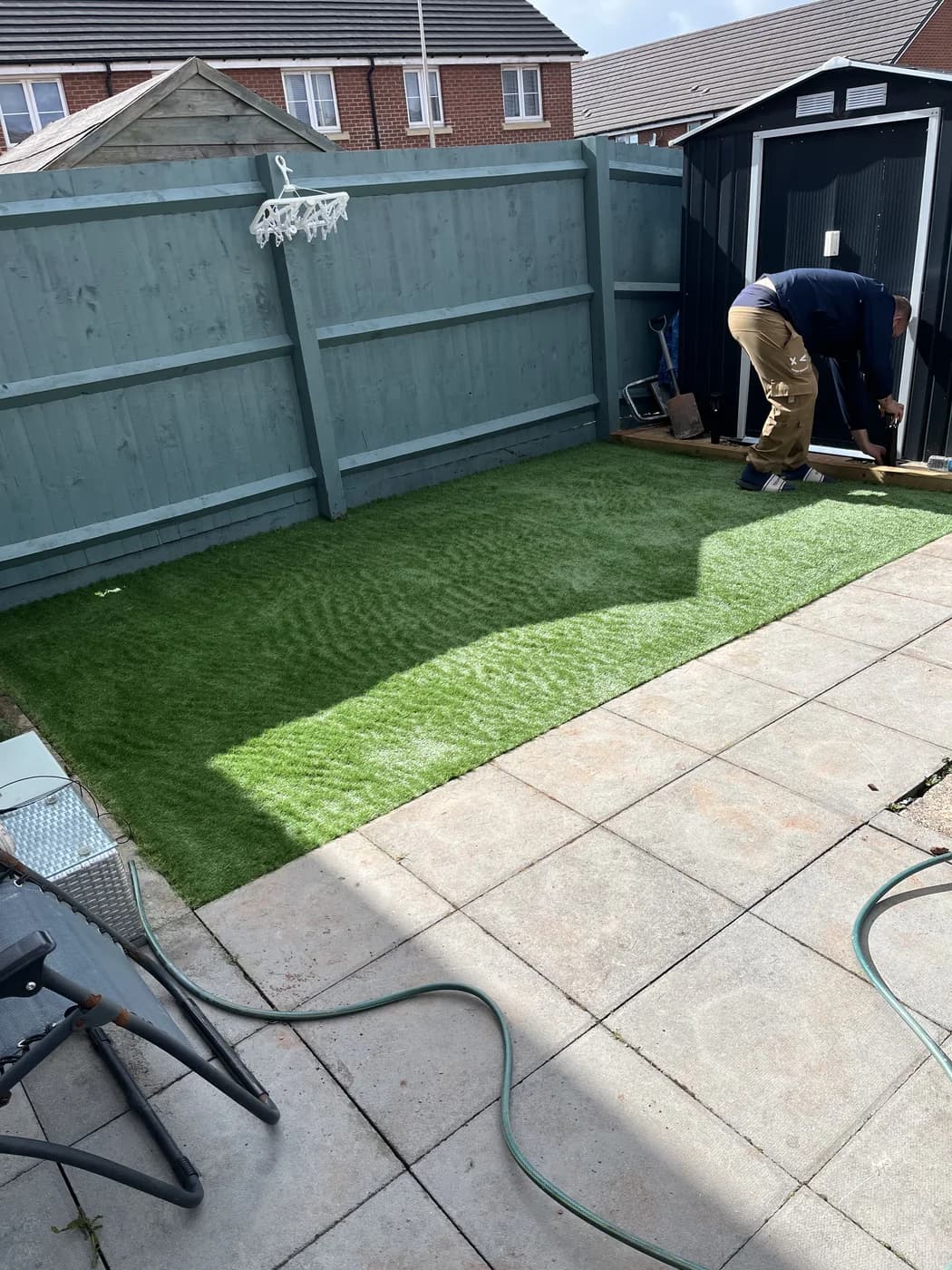 Artificial grass installation in a small garden in Pyle by HJB
